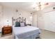 Comfortable bedroom with a ceiling fan and plenty of closet space at 10461 W Devonshire Ave, Phoenix, AZ 85037