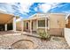 House exterior showcasing a covered entryway and desert landscaping at 10461 W Devonshire Ave, Phoenix, AZ 85037