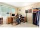 Functional home office with a desk, chair, and ample storage at 10461 W Devonshire Ave, Phoenix, AZ 85037