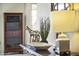 Elegant entryway with decorative accents and a wooden console table at 10631 W Brookside Dr, Sun City, AZ 85351