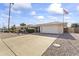 Front view of the house with a spacious driveway at 10631 W Brookside Dr, Sun City, AZ 85351