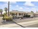 Single story home with landscaped front yard and two-car garage at 10631 W Brookside Dr, Sun City, AZ 85351