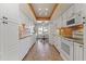 White kitchen with stainless steel appliances and an eat-in area at 10631 W Brookside Dr, Sun City, AZ 85351