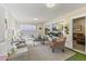 Relaxing sunroom with wicker furniture and access to the backyard at 10631 W Brookside Dr, Sun City, AZ 85351