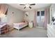 Charming bedroom with pink accents and plenty of natural light at 10713 E Hawk Ave, Mesa, AZ 85212