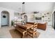 Farmhouse-style dining table with bench seating and open concept at 10713 E Hawk Ave, Mesa, AZ 85212