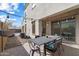 Relaxing backyard patio with string lights and outdoor dining set at 10713 E Hawk Ave, Mesa, AZ 85212