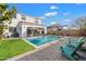 Stunning pool and patio area with lush landscaping at 10713 E Hawk Ave, Mesa, AZ 85212