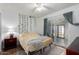 Bedroom with ceiling fan and sliding glass door to patio at 1121 S Lawther Dr, Apache Junction, AZ 85120