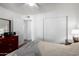 Well-lit bedroom with double door closet and wood flooring at 1121 S Lawther Dr, Apache Junction, AZ 85120