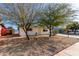 White single story home with a landscaped front yard and a covered entryway at 1121 S Lawther Dr, Apache Junction, AZ 85120