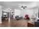 Living room, dining area, and kitchen with hardwood floors and ceiling fans at 1121 S Lawther Dr, Apache Junction, AZ 85120