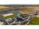 Aerial view of a community park featuring sports fields, playground, and walking paths at 12316 W Parkway Ln, Avondale, AZ 85323