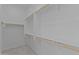 Walk-in closet provides ample storage with multiple shelves and hanging rods at 12316 W Parkway Ln, Avondale, AZ 85323