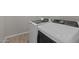 Modern laundry room equipped with high-efficiency washer and dryer at 12316 W Parkway Ln, Avondale, AZ 85323