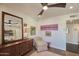 Bedroom with a dresser, chair, and large mirror at 1308 E Gardenia Dr, Phoenix, AZ 85020