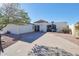 Single story home with driveway and patio seating at 1308 E Gardenia Dr, Phoenix, AZ 85020