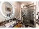 Elegant bathroom featuring a large walk-in shower and granite vanity at 13210 W Palo Verde Dr, Litchfield Park, AZ 85340