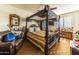 Bedroom with a four-poster bed and window seating at 13210 W Palo Verde Dr, Litchfield Park, AZ 85340