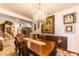 Elegant dining room with a large table, chandelier, and hardwood floors at 13210 W Palo Verde Dr, Litchfield Park, AZ 85340