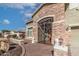 Elegant entryway with a wrought iron gate and stone pillars at 13210 W Palo Verde Dr, Litchfield Park, AZ 85340