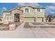 Two-story house with three-car garage and decorative gate at 13210 W Palo Verde Dr, Litchfield Park, AZ 85340