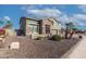 Two-story house with stone accents and landscaping at 13210 W Palo Verde Dr, Litchfield Park, AZ 85340