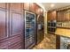 Gourmet kitchen features stainless steel appliances and a wine cooler at 13210 W Palo Verde Dr, Litchfield Park, AZ 85340