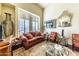 Living room featuring a sofa, armchairs, and a coffee table at 13210 W Palo Verde Dr, Litchfield Park, AZ 85340