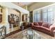 Living room with a comfortable sofa and large windows at 13210 W Palo Verde Dr, Litchfield Park, AZ 85340