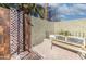 Outdoor shower with tiled walls and a wooden bench at 13210 W Palo Verde Dr, Litchfield Park, AZ 85340