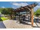 Peaceful backyard patio with pergola and seating area at 13210 W Palo Verde Dr, Litchfield Park, AZ 85340