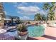 Relaxing pool area with palm trees and a spacious patio at 13210 W Palo Verde Dr, Litchfield Park, AZ 85340