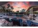 Relaxing pool area with lounge chairs and sunset at 13210 W Palo Verde Dr, Litchfield Park, AZ 85340