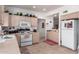 Galley style kitchen with white appliances and wood cabinets at 13840 N Mirage Heights W Ct # 217, Fountain Hills, AZ 85268