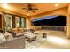 Outdoor balcony with seating area and mountain views at sunset at 14179 E Kalil Dr, Scottsdale, AZ 85259