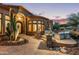 Elegant entryway with arched doorway and stone accents at 14179 E Kalil Dr, Scottsdale, AZ 85259