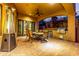 Covered patio with outdoor kitchen and seating area at 14179 E Kalil Dr, Scottsdale, AZ 85259