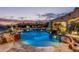 Inviting pool and patio area with fire pit at 14179 E Kalil Dr, Scottsdale, AZ 85259