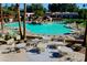 Inviting community pool with tables and umbrellas at 14300 W Bell Rd # 326, Surprise, AZ 85374