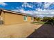 Landscaped backyard with gravel and small tree at 14353 W Ventura St, Surprise, AZ 85379