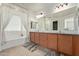 Bathroom with double vanity and granite countertop at 14353 W Ventura St, Surprise, AZ 85379