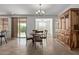 Bright dining area with tile floors and built-in hutch at 14353 W Ventura St, Surprise, AZ 85379