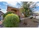 Side view of the house with landscaping and walkway at 14353 W Ventura St, Surprise, AZ 85379