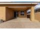 Covered patio with paver stones and access to backyard at 14353 W Ventura St, Surprise, AZ 85379