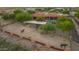 Aerial view of property showing horse stables and paddocks at 14521 E Desert Vista Trl, Scottsdale, AZ 85262