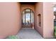 Elegant entryway with arched door and decorative accents at 14521 E Desert Vista Trl, Scottsdale, AZ 85262