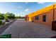 View of home's side showcasing garage and brick driveway at 14521 E Desert Vista Trl, Scottsdale, AZ 85262