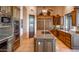 Gourmet kitchen with granite countertops and custom wood cabinetry at 14521 E Desert Vista Trl, Scottsdale, AZ 85262