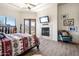 Main bedroom with fireplace, access to backyard and pool views at 14521 E Desert Vista Trl, Scottsdale, AZ 85262